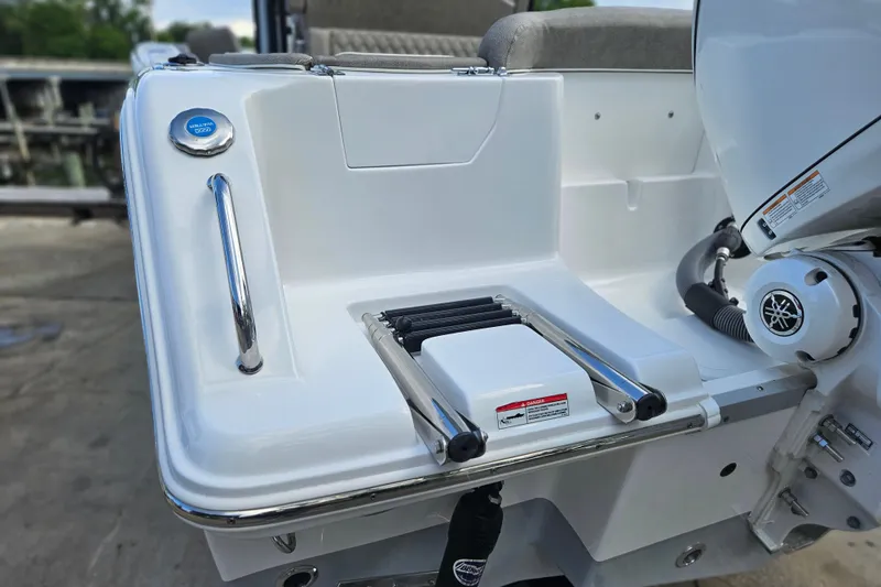 Slide: The Image of 2026 Sea Hunt Ultra 245 SE boat with swim platform and ladder detail. - 6