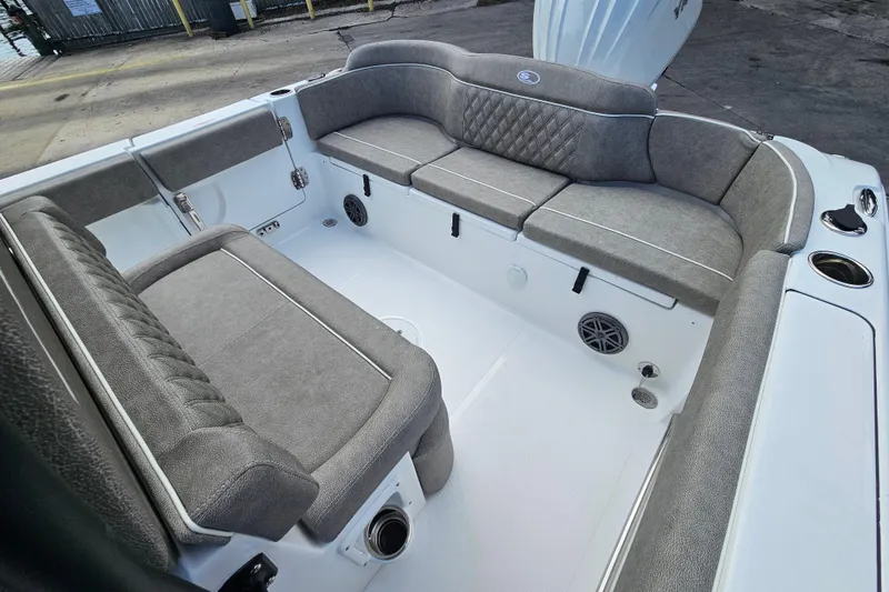 Slide: The Image of Interior view of 2026 Sea Hunt Ultra 245 SE boat with gray cushioned seating. - 9