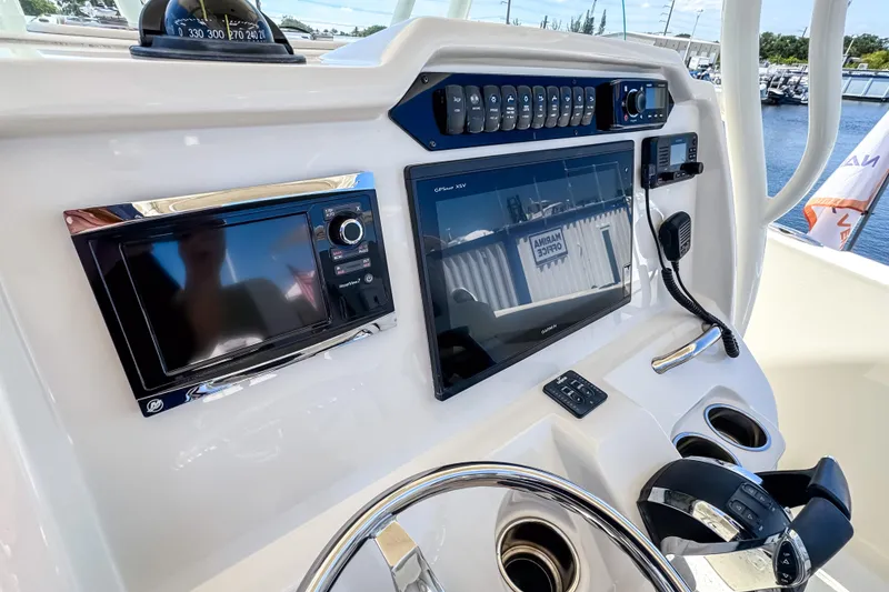 Slide: The Image of Control panel of 2016 Sailfish 290 CC boat with navigation and communication equipment. - 35