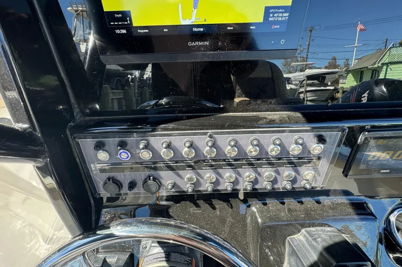 Slide: The Image of Control panel of a 2022 Tidewater 256 CC Adventure boat with Garmin display. - 10
