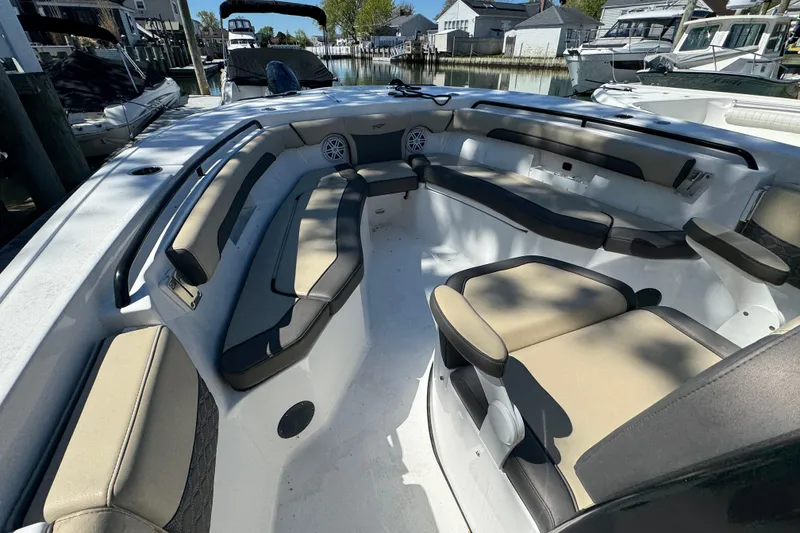 Slide: The Image of 2022 Tidewater 256 CC Adventure boat interior with spacious seating and modern design. - 18