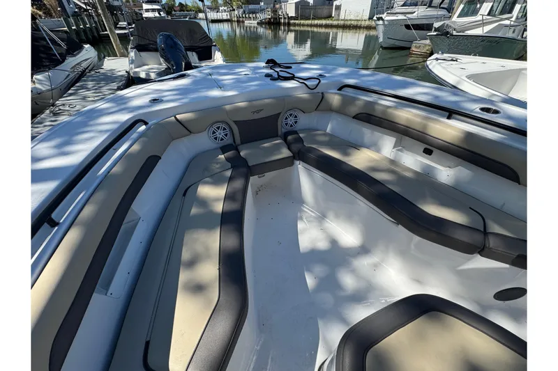 Slide: The Image of 2022 Tidewater 256 CC Adventure boat interior with spacious seating and modern design. - 20