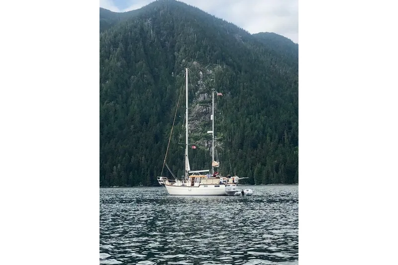 The Image of Sailboat Nauticat Staysail Ketch 2001 anchored in scenic mountain lake. - 0