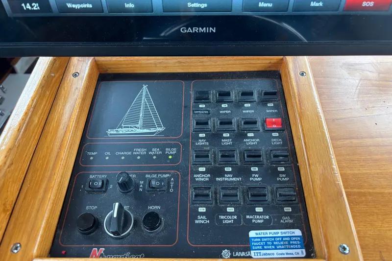 Slide: The Image of Control panel of a 2001 Nauticat Staysail Ketch with various switches and indicators. - 10