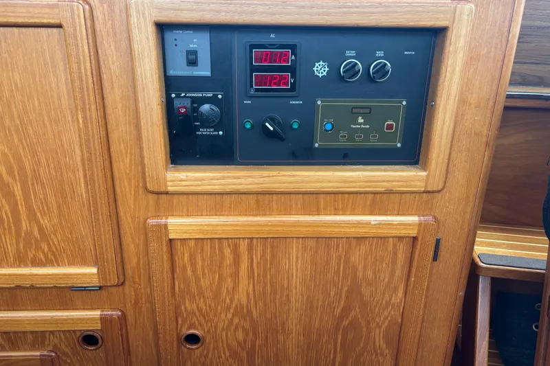 Slide: The Image of Control panel of a 2001 Nauticat Staysail Ketch with wooden cabinetry. - 13