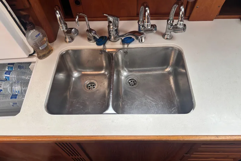 Slide: The Image of Stainless steel double sink in 2001 Nauticat Staysail Ketch galley. - 19