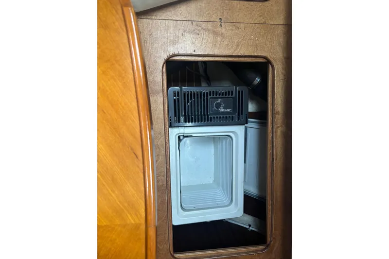 Slide: The Image of Wooden interior of 2001 Nauticat Staysail Ketch with built-in refrigerator. - 23