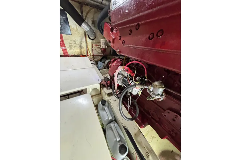 Slide: The Image of Engine room of 2001 Nauticat Staysail Ketch, showcasing mechanical components and wiring. - 29