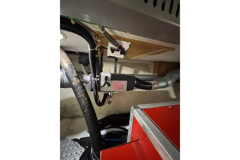 Slide: The Image of Engine room of 2001 Nauticat Staysail Ketch with visible wiring and components. - 30