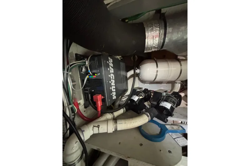 Slide: The Image of Engine room of 2001 Nauticat Staysail Ketch with Magnum inverter and plumbing components. - 31