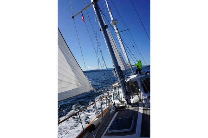 Slide: The Image of Sailing on a 2001 Nauticat Staysail Ketch in open sea under clear blue skies. - 4