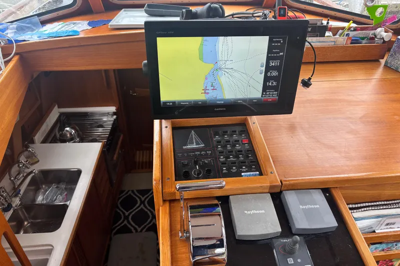 Slide: The Image of Nauticat Staysail Ketch 2001 interior with navigation equipment and wooden cabinetry. - 8