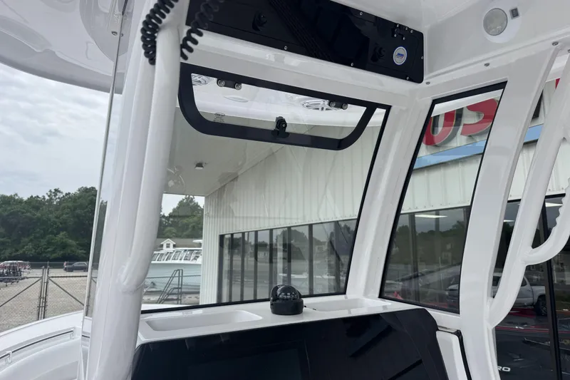 Slide: The Image of 2026 Sportsman Open 212 Center Console boat interior with modern dashboard and controls. - 13