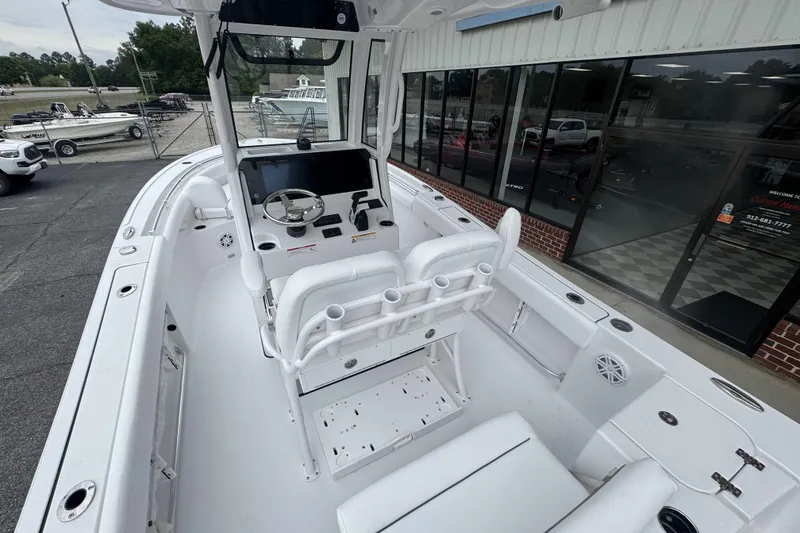Slide: The Image of 2026 Sportsman Open 212 Center Console boat interior with helm and seating. - 14