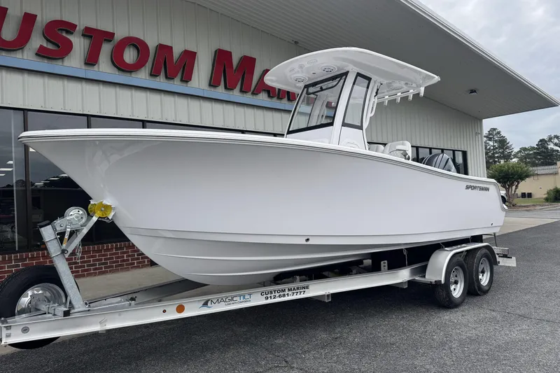 Slide: The Image of 2026 Sportsman Open 212 Center Console boat on trailer at Custom Marine dealership. - 3