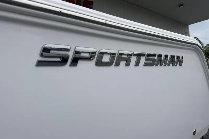 Slide: The Image of 2026 Sportsman Open 212 Center Console boat logo on white hull. - 4