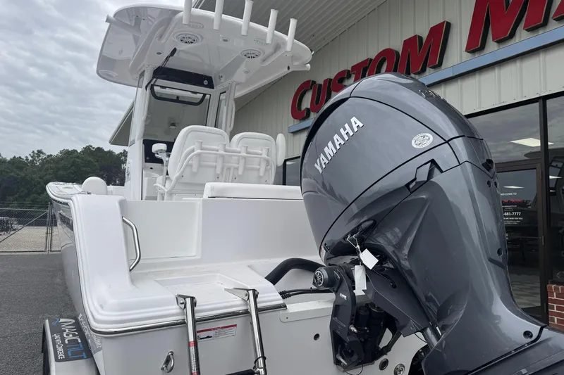 Slide: The Image of 2026 Sportsman Open 212 Center Console boat with Yamaha engine at dealership. - 6