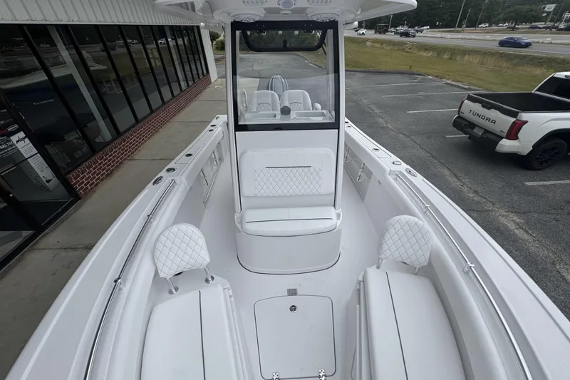 Slide: The Image of 2026 Sportsman Open 212 Center Console boat with white seating and modern design. - 8