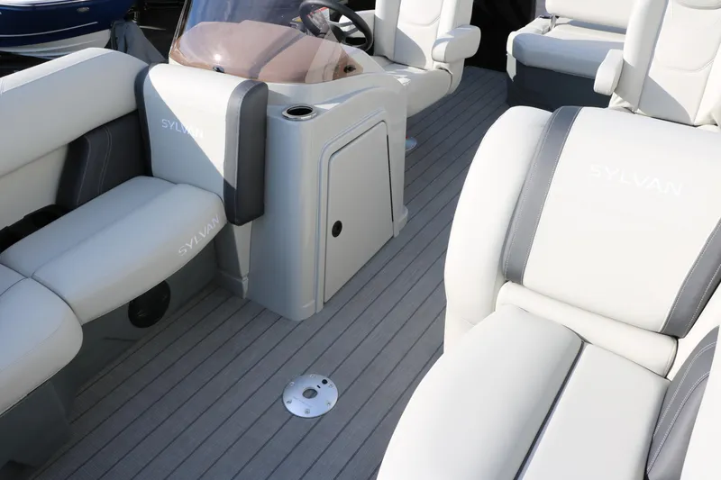 Slide: The Image of 2026 Sylvan Mirage 820 CLZ DH Premium Pontoon interior with plush seating and modern design. - 12