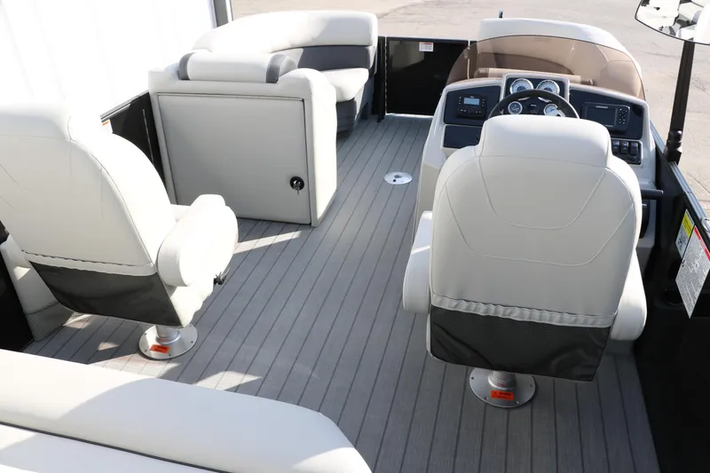 Slide: The Image of Interior of 2026 Sylvan Mirage 820 CLZ DH Premium Pontoon with plush seating and modern dashboard. - 17
