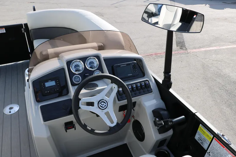 Slide: The Image of 2026 Sylvan Mirage 820 CLZ DH Premium Pontoon dashboard with steering wheel and controls. - 19