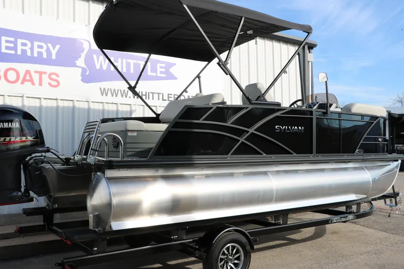 Slide: The Image of 2026 Sylvan Mirage 820 CLZ DH Premium Pontoon with Yamaha engine, displayed outdoors. - 2