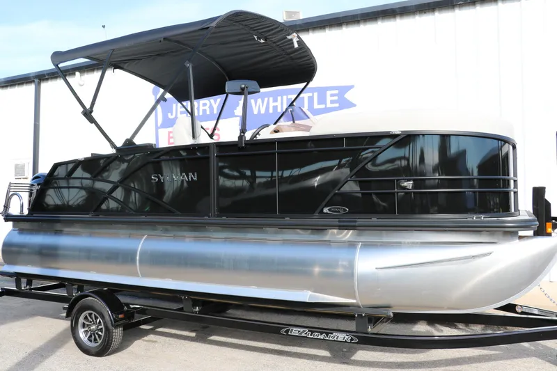 Slide: The Image of 2026 Sylvan Mirage 820 CLZ DH Premium Pontoon with sleek black design on trailer. - 3