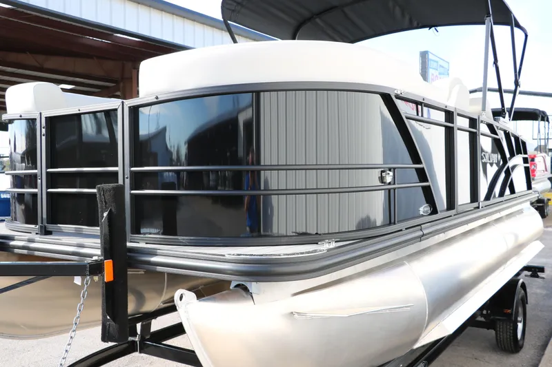Slide: The Image of 2026 Sylvan Mirage 820 CLZ DH Premium Pontoon, sleek design, docked outdoors. - 4