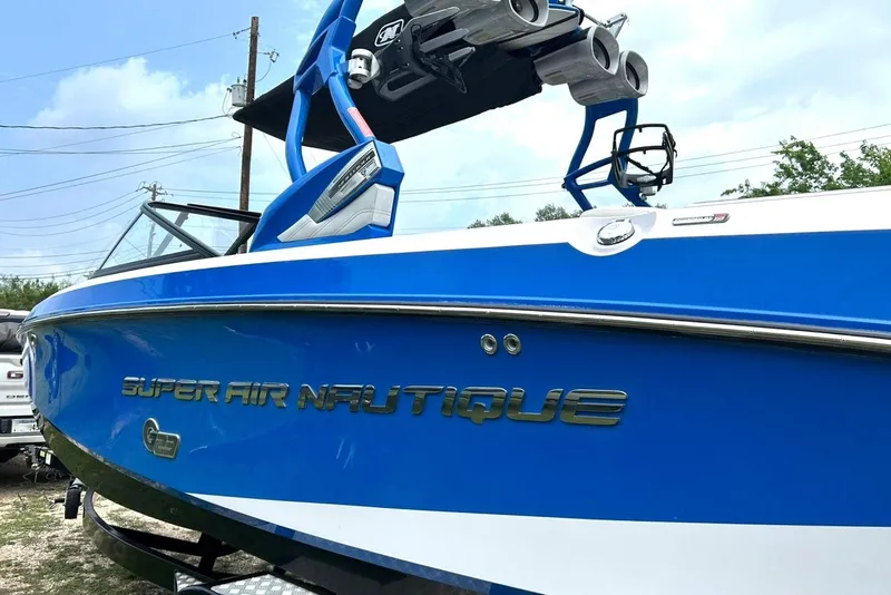 Slide: The Image of Blue 2013 Nautique Super Air Nautique G23 boat with tower speakers. - 17