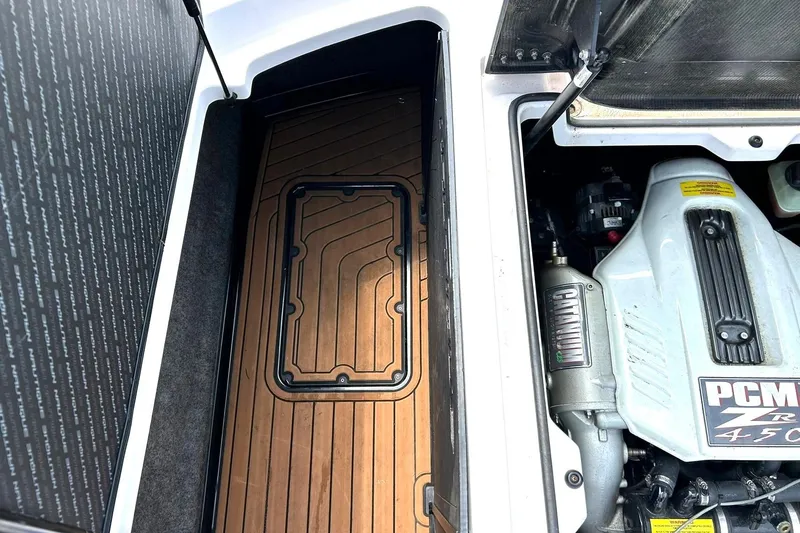 Slide: The Image of 2013 Nautique Super Air Nautique G23 engine compartment with PCM ZR 450 engine. - 27