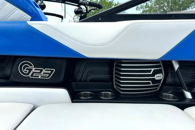 Slide: The Image of 2013 Nautique Super Air Nautique G23 interior with Polk Audio speaker and cup holders. - 34