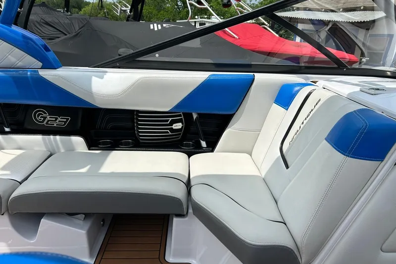 Slide: The Image of Interior of 2013 Nautique Super Air Nautique G23 boat with blue and white seating. - 35