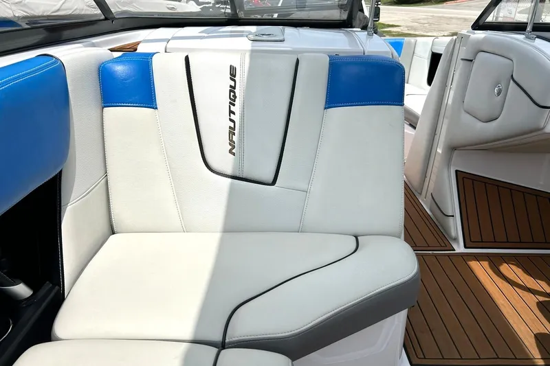 Slide: The Image of 2013 Nautique Super Air Nautique G23 interior with white and blue seating. - 36
