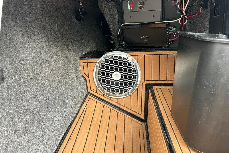 Slide: The Image of 2013 Nautique Super Air Nautique G23 interior with speaker and audio system. - 38