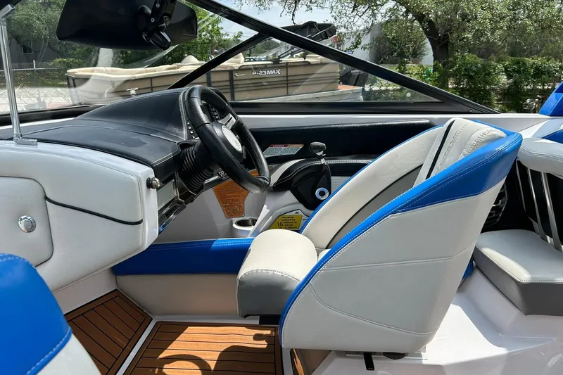 Slide: The Image of Interior of 2013 Nautique Super Air Nautique G23 boat with blue and white seating. - 39