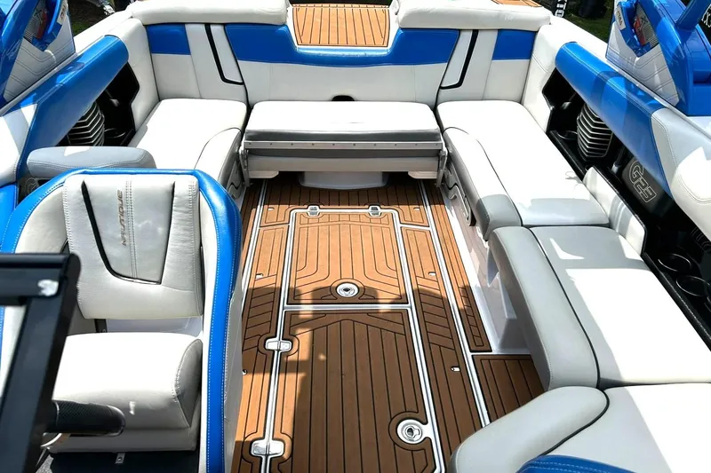 Slide: The Image of Luxurious interior of 2013 Nautique Super Air Nautique G23 boat with blue and white seating. - 4