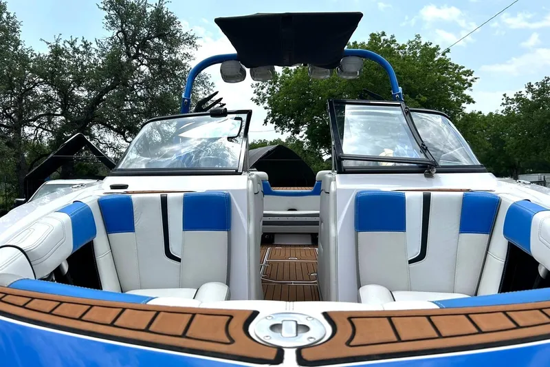 Slide: The Image of 2013 Nautique Super Air Nautique G23 boat interior with blue and white seating. - 43