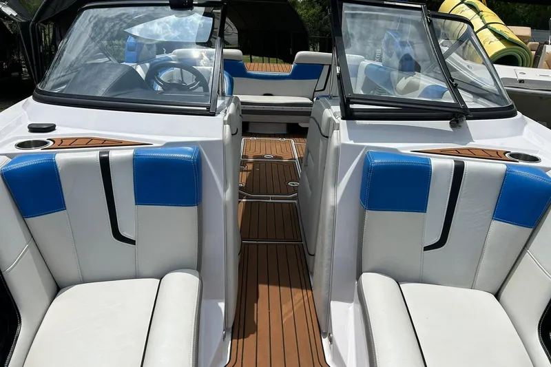 Slide: The Image of Interior of 2013 Nautique Super Air Nautique G23 boat with blue and white seating. - 45
