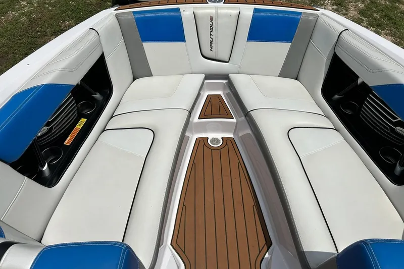Slide: The Image of Interior of 2013 Nautique Super Air Nautique G23 boat with blue and white seating. - 46