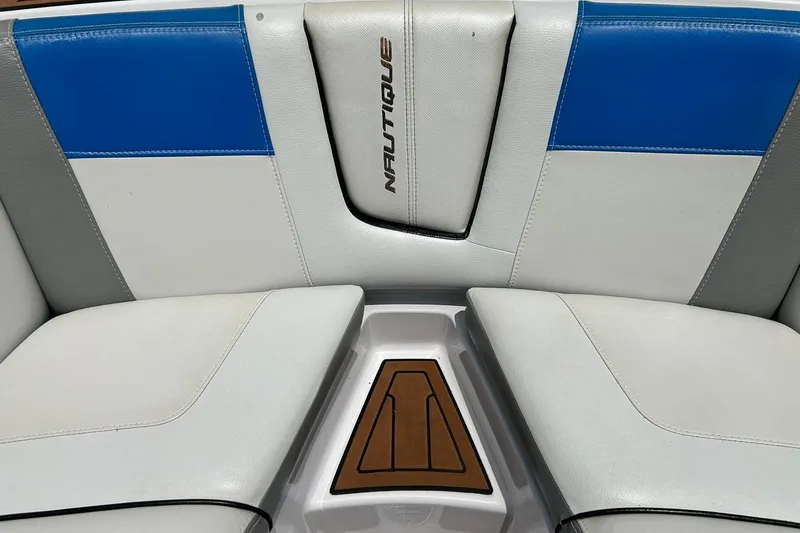 Slide: The Image of Interior seating of 2013 Nautique Super Air Nautique G23 boat, featuring blue and white upholstery. - 47
