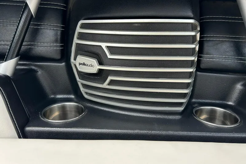 Slide: The Image of Polk Audio speaker and cup holders in 2013 Nautique Super Air Nautique G23 boat interior. - 48