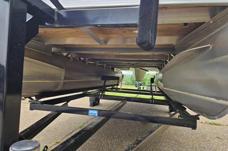 Slide: The Image of Underneath view of a 2012 Sweetwater 20sf pontoon boat on a trailer. - 3