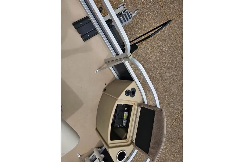 Slide: The Image of 2012 Sweetwater 20sf boat interior with control panel and seating area. - 8
