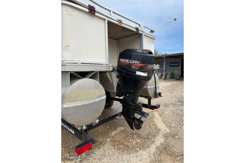 Slide: The Image of 2003 Sun Tracker Party Barge 24 with Mercury 90 outboard motor on trailer. - 9
