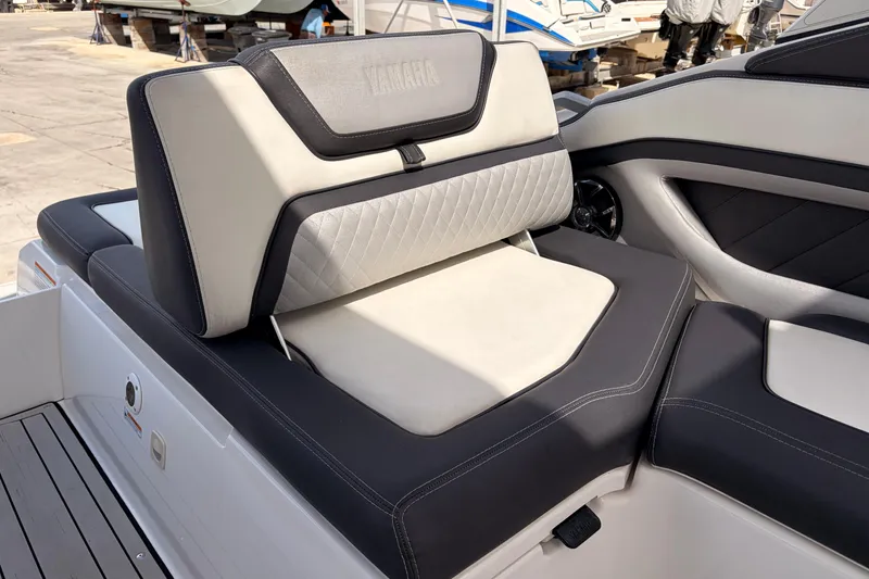 Slide: The Image of 2021 Yamaha Boats 275SD interior seating with luxurious upholstery and modern design. - 11