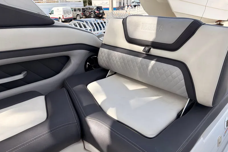 Slide: The Image of 2021 Yamaha Boats 275SD interior seating with luxurious upholstery and modern design. - 12