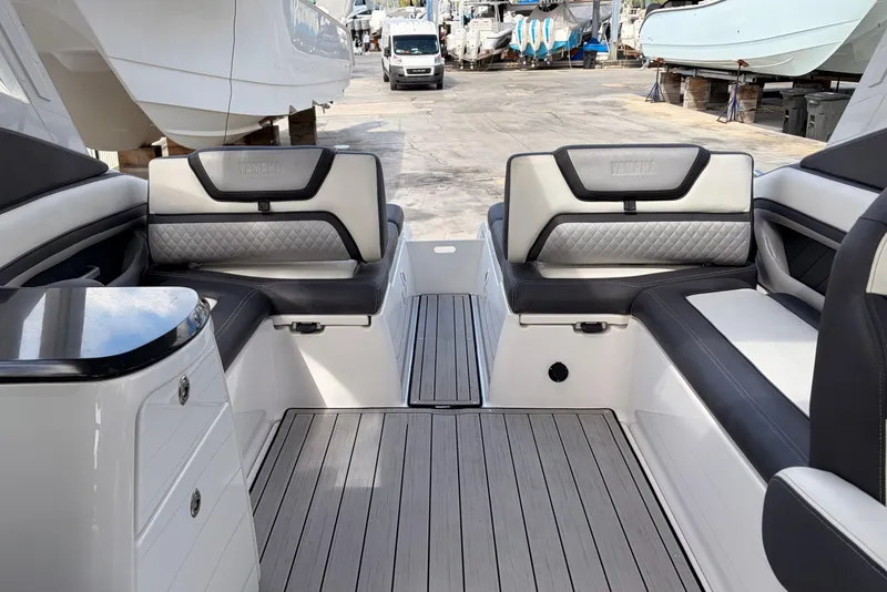 Slide: The Image of 2021 Yamaha Boats 275SD interior with luxurious seating and sleek design. - 13