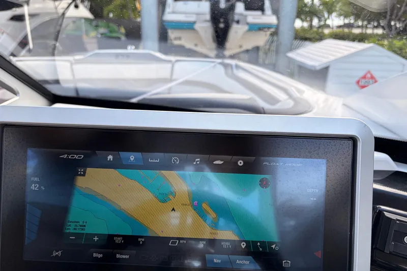 Slide: The Image of Dashboard view of 2021 Yamaha Boats 275SD with navigation display. - 21