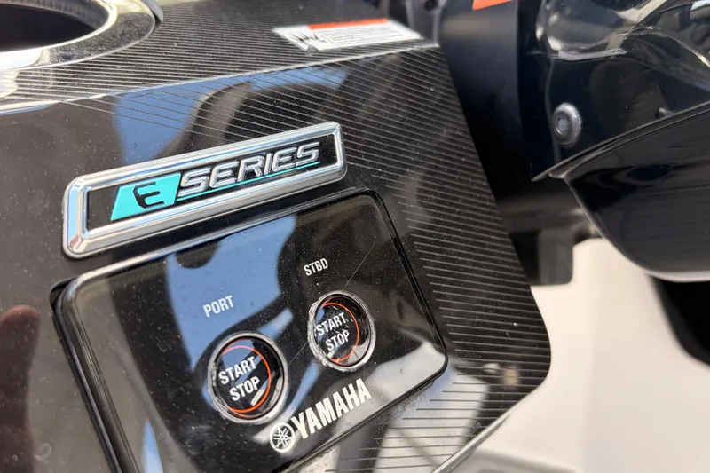 Slide: The Image of Close-up of 2021 Yamaha Boats 275SD E-Series start/stop controls. - 24