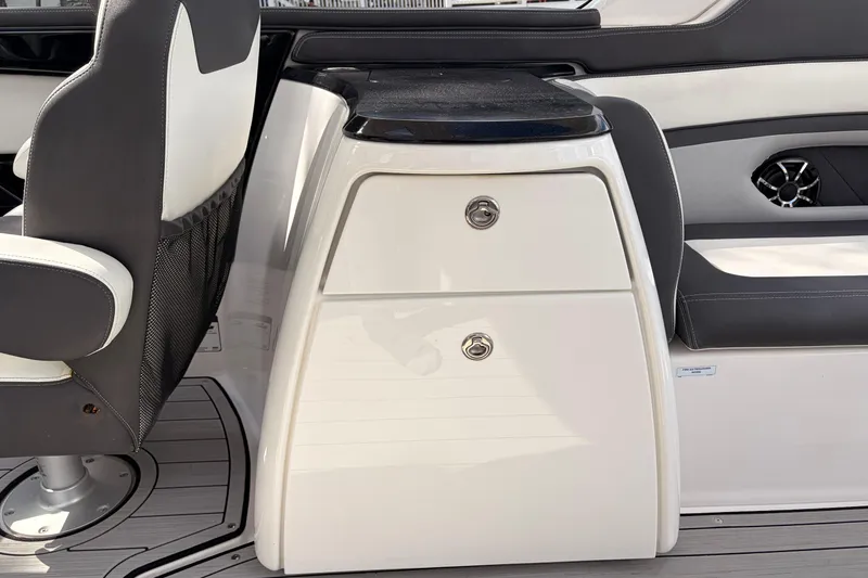 Slide: The Image of 2021 Yamaha Boats 275SD interior with seating and storage compartments. - 28
